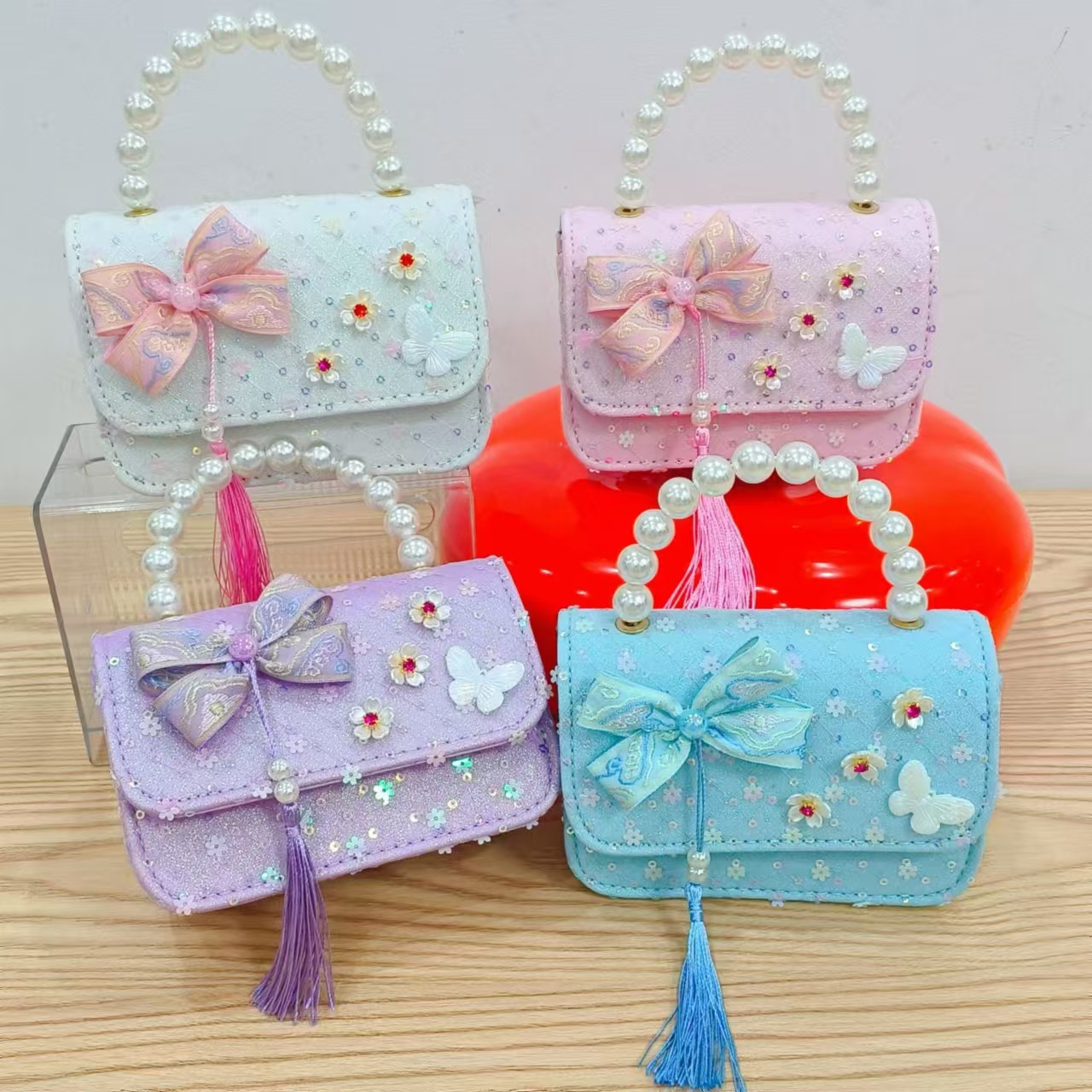 Niños pequeños viento fragrante hombro alto sentido de la chica antigua bolso de cambio princesa perla accesorios de ropa china portátil mochila