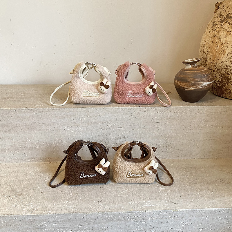 2025 otoño y invierno nuevo bolso infantil lindo peluche conejo pequeño bolso de cambio bebé mini bolso de hombro para hombres y mujeres