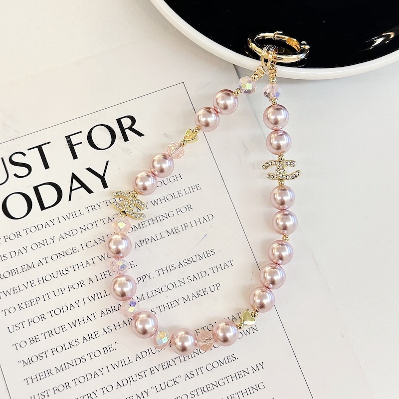 Boutique hecho a mano de alta gama cadena de teléfono móvil cadena de pulsera de perlas de tres colores cordón de teléfono móvil de moda colgante de mensajero largo