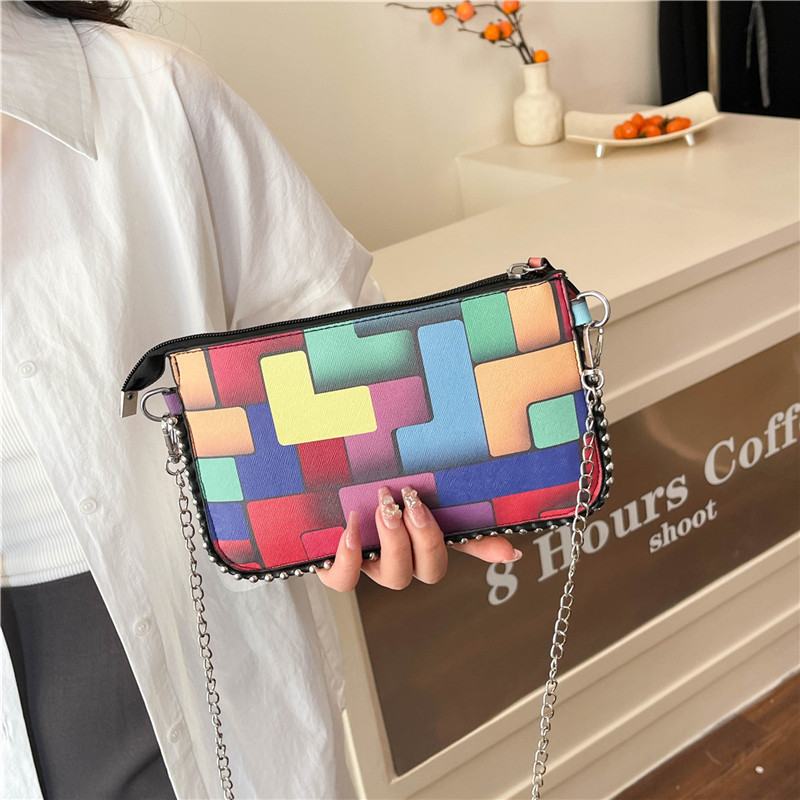 Personalidad de la tendencia de colores bolsos de mujer pintados 2025 nueva cadena de moda bolsos de mano simple bolsos de hombro de moda