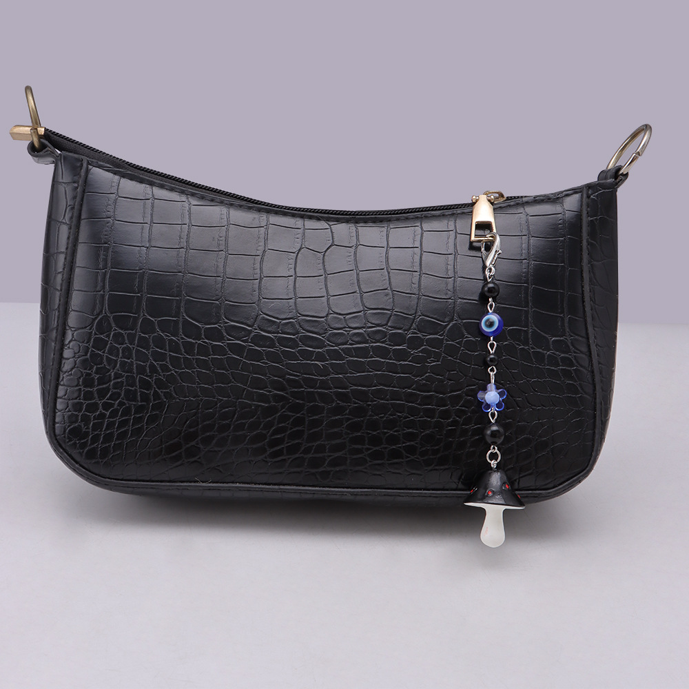 La versión coreana transfronteriza de la joyería de llavero de setas de color, la resina de dibujos animados, el ojo creativo del diablo, el bolso, el colgante de accesorios