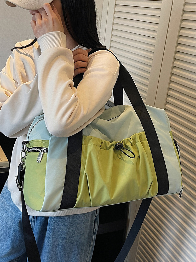 Bolsas deportivas de gran capacidad de ocio, bolsas de viaje de hombro simples de moda para mujeres, bolsas de mano ligeras de tirado.