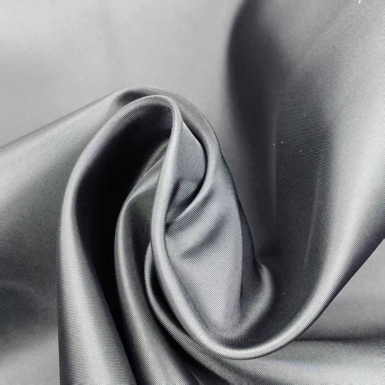 Large quantities of black and white spot polyester taffeta clothing…