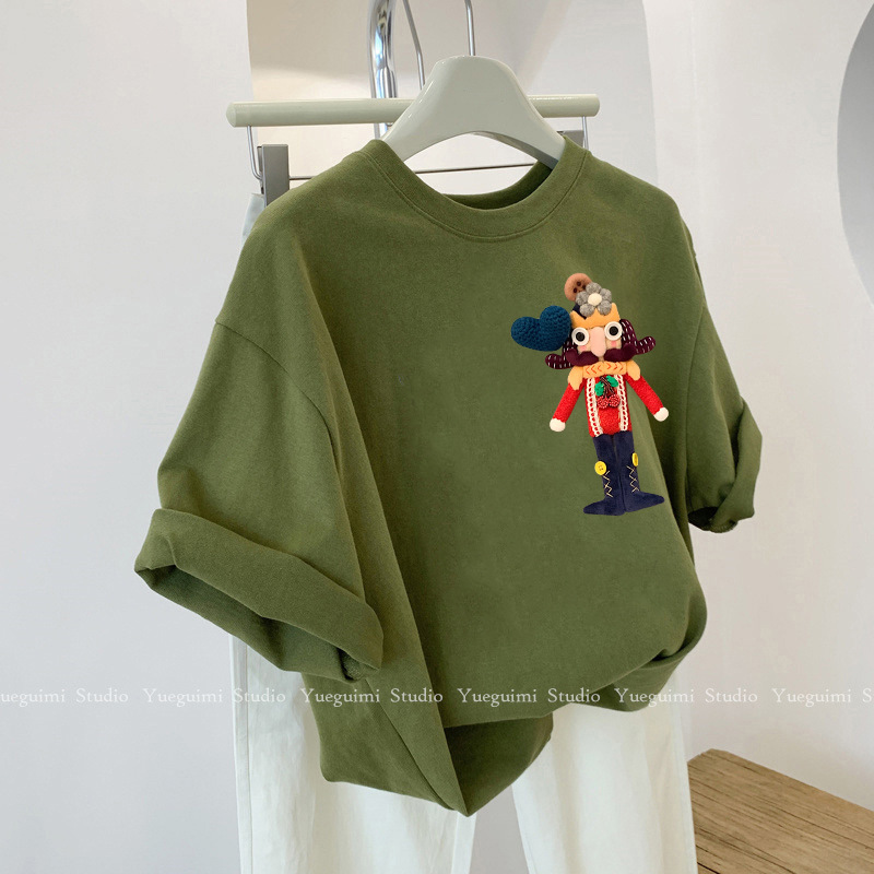 Green three dimensional cotton doll