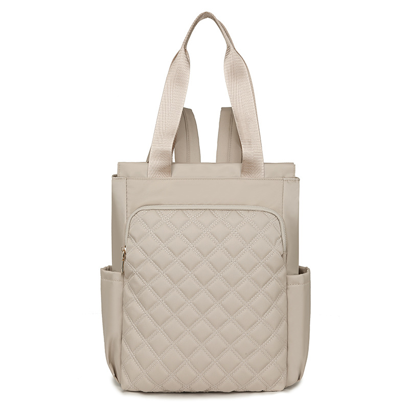 Mochila de mujer salvaje de color puro 2024 nueva mochila portátil de moda, bolso de viaje ligero y de gran capacidad