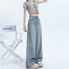 水色の水洗いワイドジーンズの女性春秋2025の新型の穴が開いたデザイン感があります。