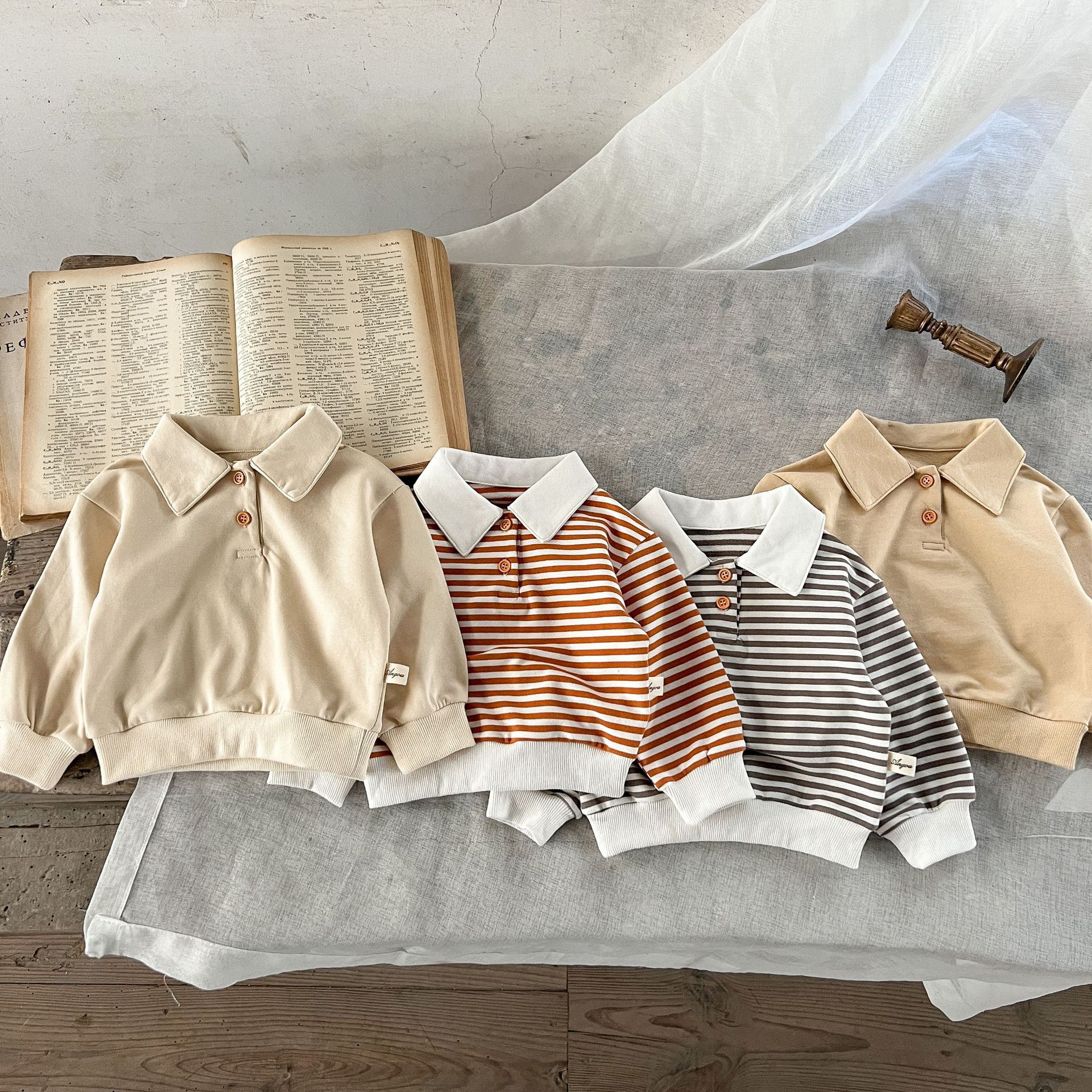 Estilo coreano ins suéter rayado del bebé neutral de los hombres flojos y niñas cuello POLO primavera superior