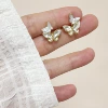186-Two butterflies Zircon Mosquito coil ear clips