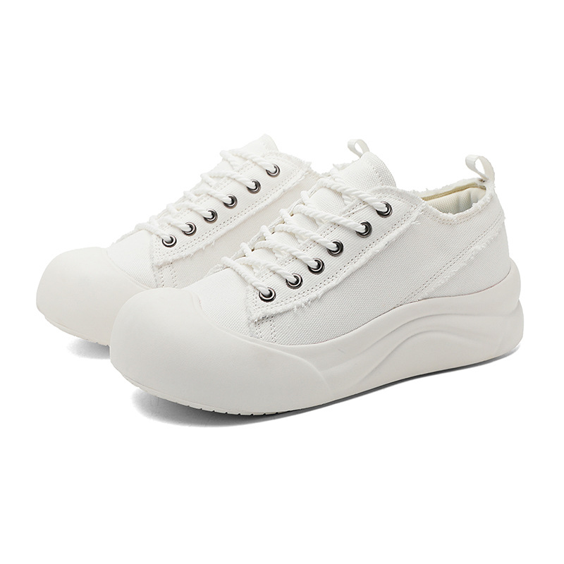 Diseño de nicho pareja zapatos de lona de cabeza grande suela gruesa zapatos casuales de todo fósforo otoño al aire libre zapatos de skate de moda coreana