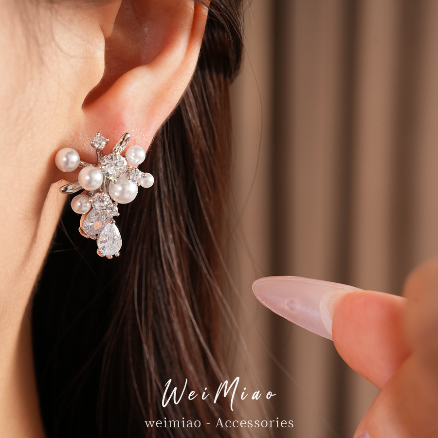 Agujas de plata mariposa gota de piedra aretes de perlas ligeros de lujo de alta calidad pernos diarios temperamento al por mayor auriculares