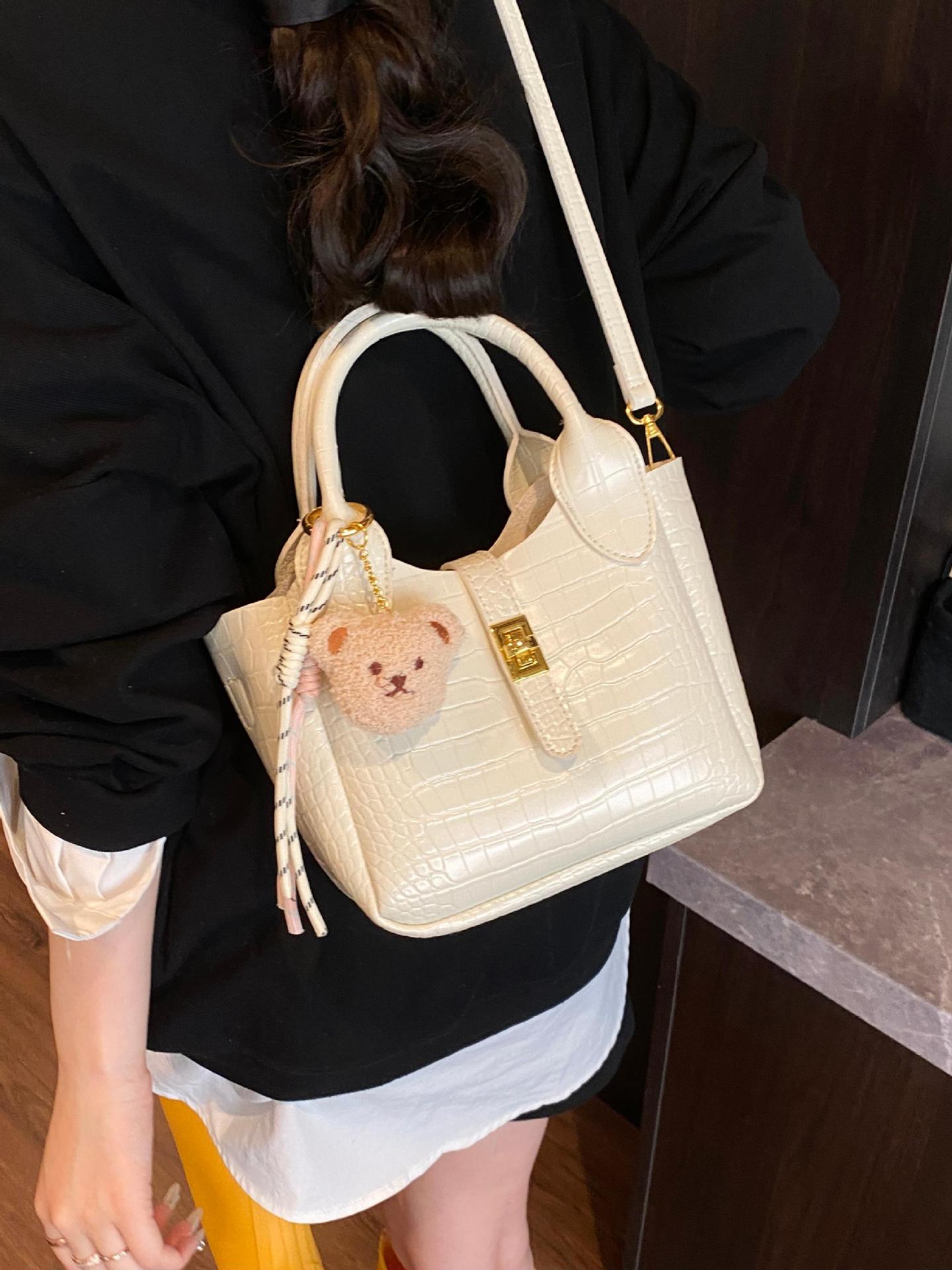 Comercio exterior super fuego patrón de cocodrilo llevar a mano bolso de cubo mujer 2025 nuevo bolso de hombro de viaje de moda bolso de mensajero de todo fósforo