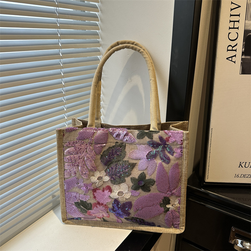 Explosiones transfronterizas 2026 textura de lino de alta calidad, flores bordadas, bolsas de tendencia horizontales, bolsas de compras de aire exterior