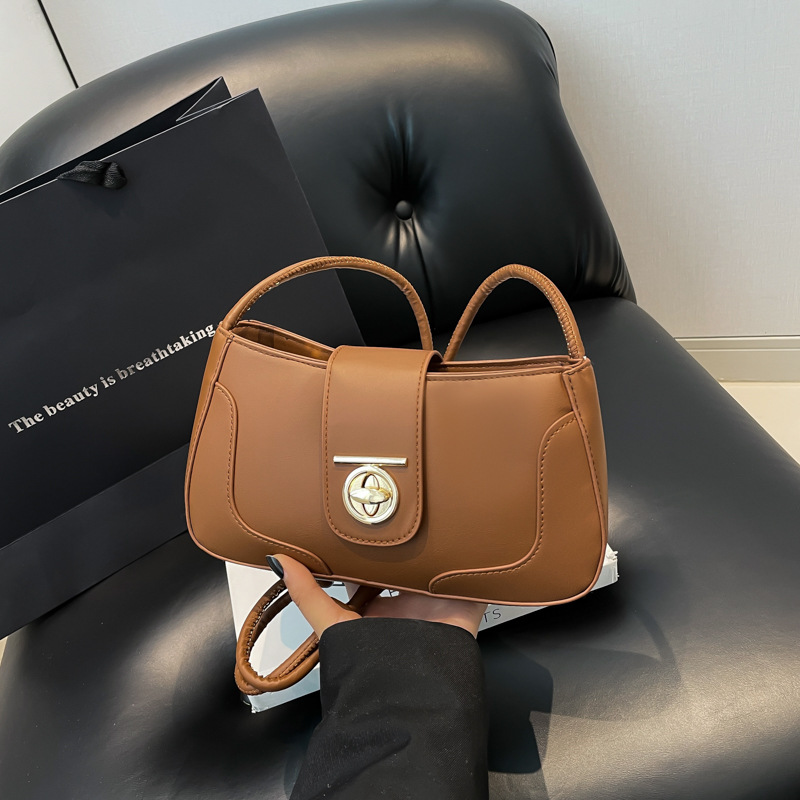 Bolsos debajo de las axilas mujeres 2024 invierno nueva moda de nicho simple diseño de hombro bolso retrógrado bolso pequeño