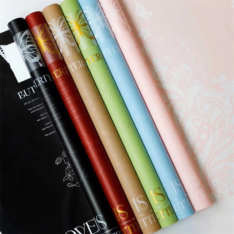 Flores fábrica de fiesta al por mayor nuevos productos transfronterizos mariposa hueca flor florista embalaje de papel impermeable material de embalaje ramo