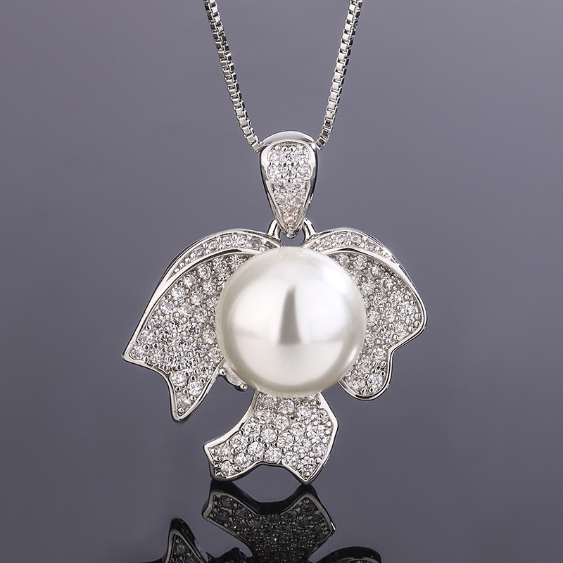 2023 Nueva Zhuang Sheng joyas de cobre de fondo chapado en oro perla joyería de moda traje de 12mm