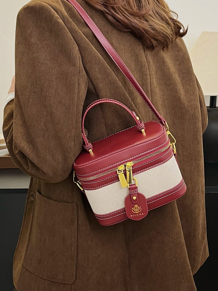 Bolso de mano de alta sensación para mujeres 2025, nueva moda transfronteriza, bolso de caja de empalme de color, bolso casual, bolso cuadrado simple