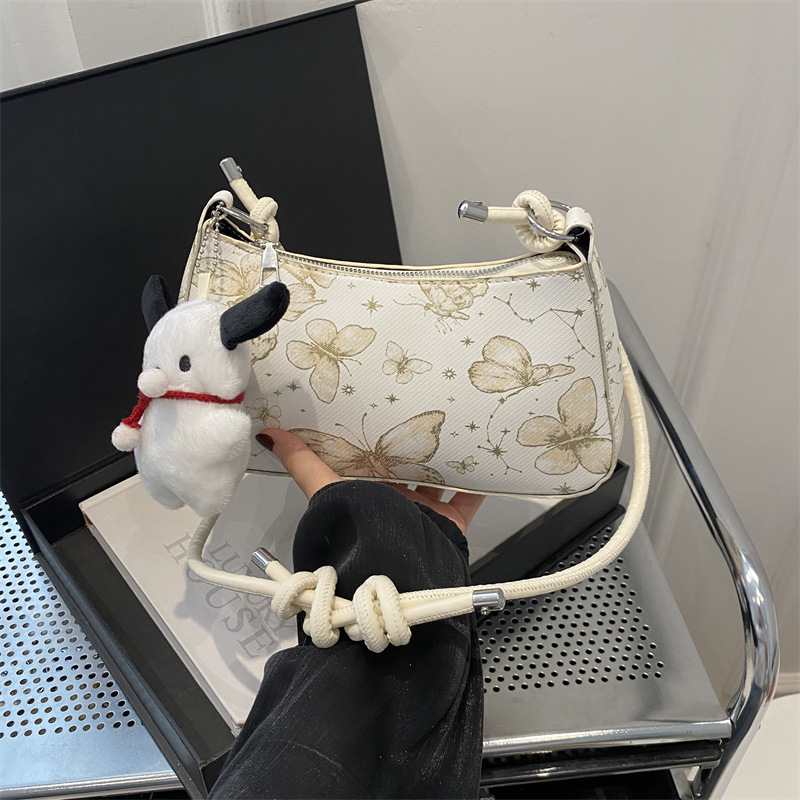 Bolso de diseño de nicho para mujeres 2024 nuevo estilo coreano lindo bolso de brazo portátil para mujeres sensación de alta calidad de una sola mochila de hombro de moda