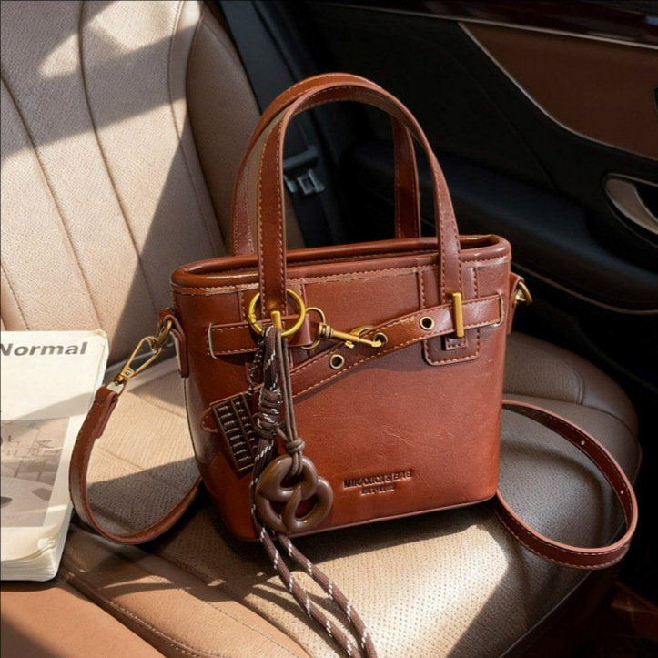 Coreano de alta calidad elegante bolso de cubo portátil para mujeres 2025 nuevo retro versátil viaje mochila de hombro