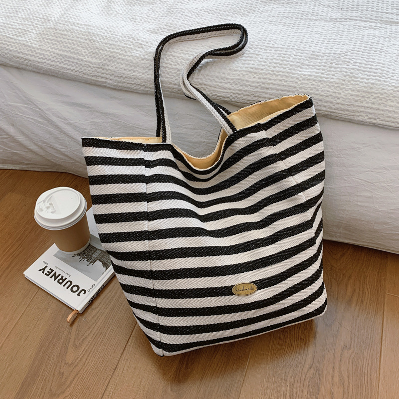 Bolsas de lona a rayas de doble cara nicho de mujeres coreanas de gran capacidad perezosa bolsas de compras de ocio de estudiantes
