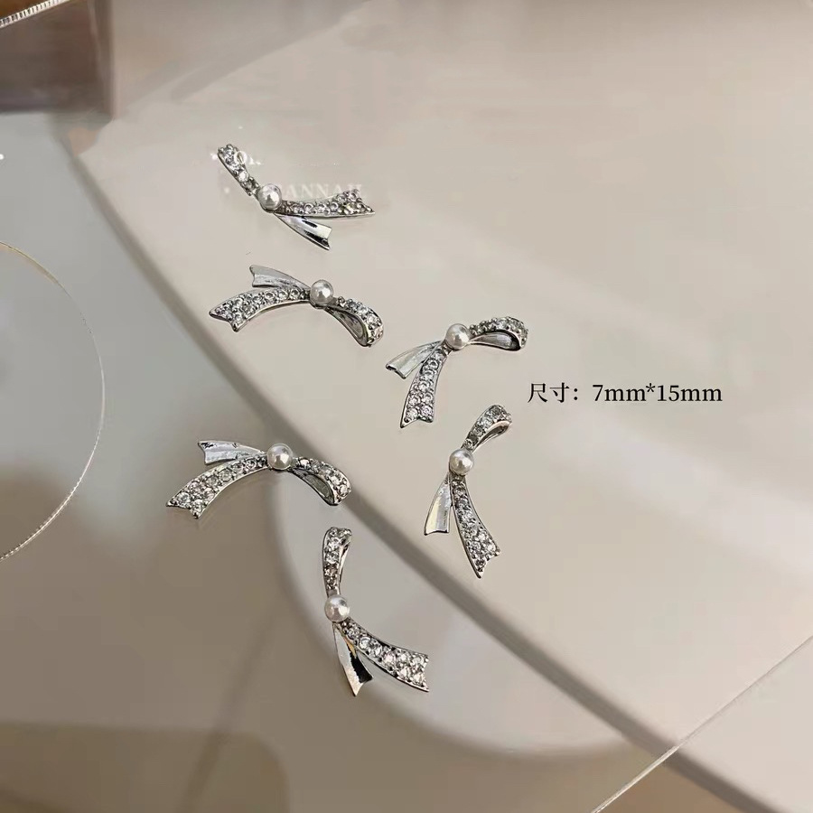 Celebridad de Internet nuevos accesorios de uñas Iris arco de alta retención de color ajuste arco de uñas diamante desgaste material de uñas diamante