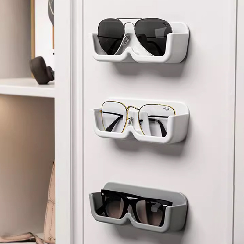 Nueva caja de almacenamiento de gafas sin perforar caja de almacenamiento montada en la pared hogar Simple miopía gafas de sol rack de almacenamiento al por mayor