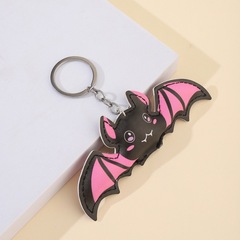 ピンクのハロウィーンのテーマパーティーのコウモリのバッグのストラップはカップルのかわいいピンクのコウモリのキーホルダーのストラップを飾ります。