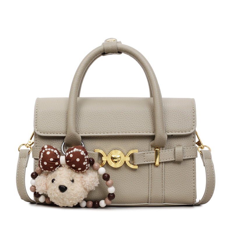 Alta textura de hardware decoración bolso de mano mujer 2026 nuevo popular litchi pattern casual versátil mochila