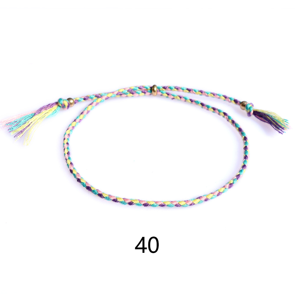 Amazon popular colorido cuerda de algodón amistad pulsera perlas de cobre borla pulsera tejida a mano ajustable hombres y mujeres pulsera