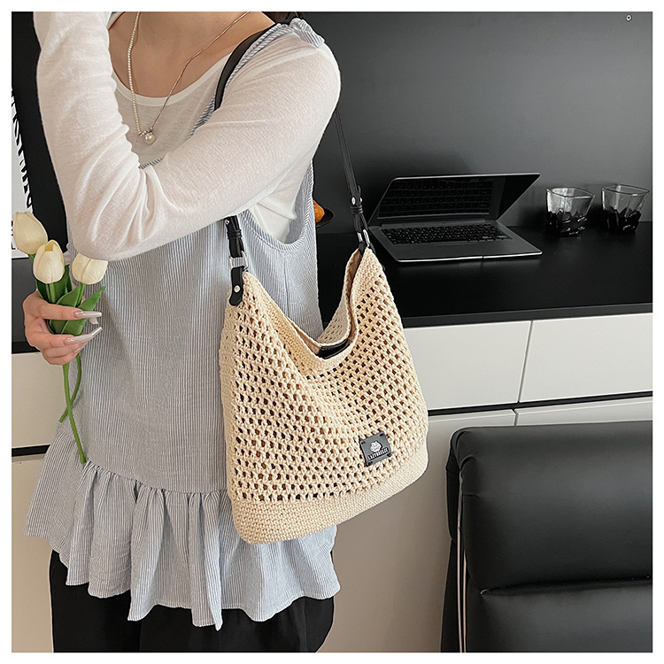 Summer hollowed-out knitted underarm bag for women, 2025 new style, laid-back and relaxed, seaside vacation style single-shoulder crossbody bag undefined