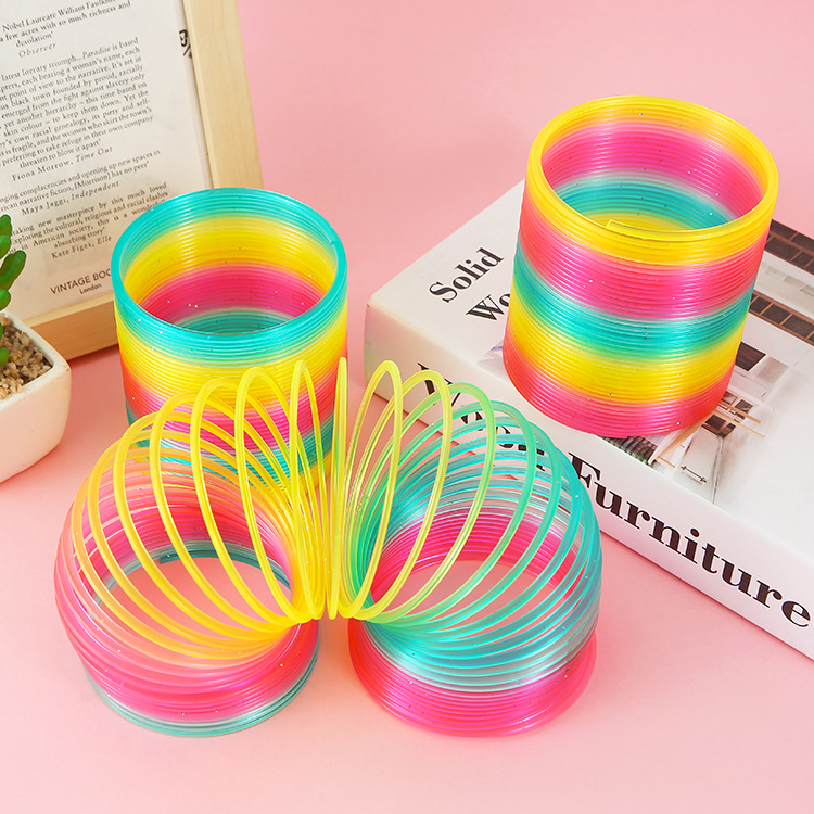 9cm bolsa de malla grande arco iris anillo Niños Primavera anillo mágico puesto Venta caliente juguetes al por mayor TikTok modelo de enseñanza