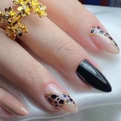 Stunning black-gold leopard-print nails with dazzling gold glitter—bold, edgy, and perfect for an Instagram-worthy fall/winter look that flatters all skin tones while exuding a mysterious, chic vibe.