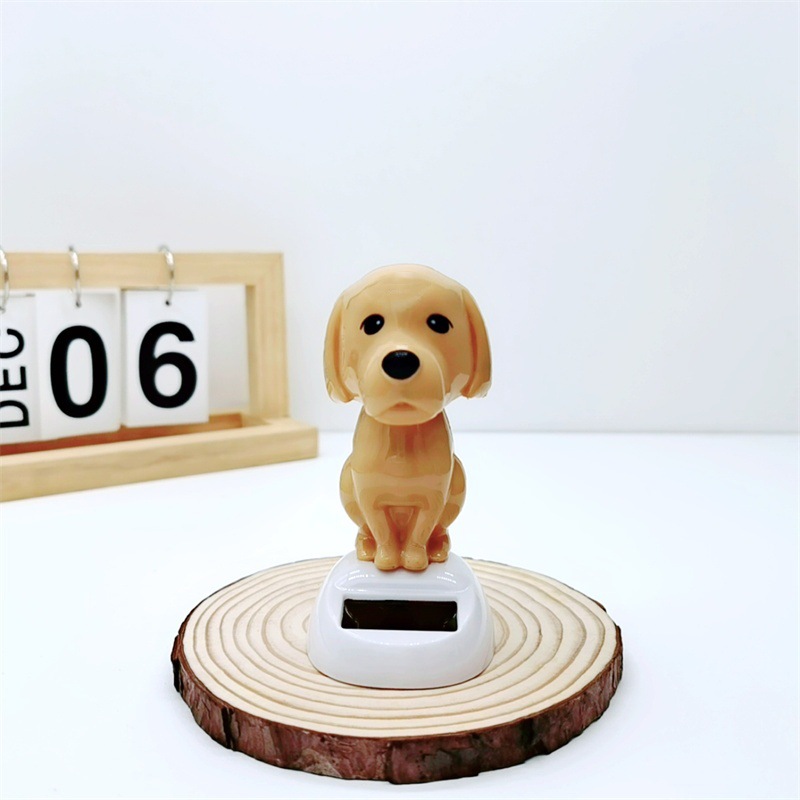 Adornos para automóviles cruzados, decoración para automóviles de resina, accesorios interiores para perros de palomitas de maíz para automóviles solares, sacudiendo la cabeza y llamando a la muñeca