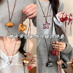 かわいい大衆デザインアルカリ水結びパンペンダントネックレス女性秋冬牛角包長毛服チェーンアクセサリー