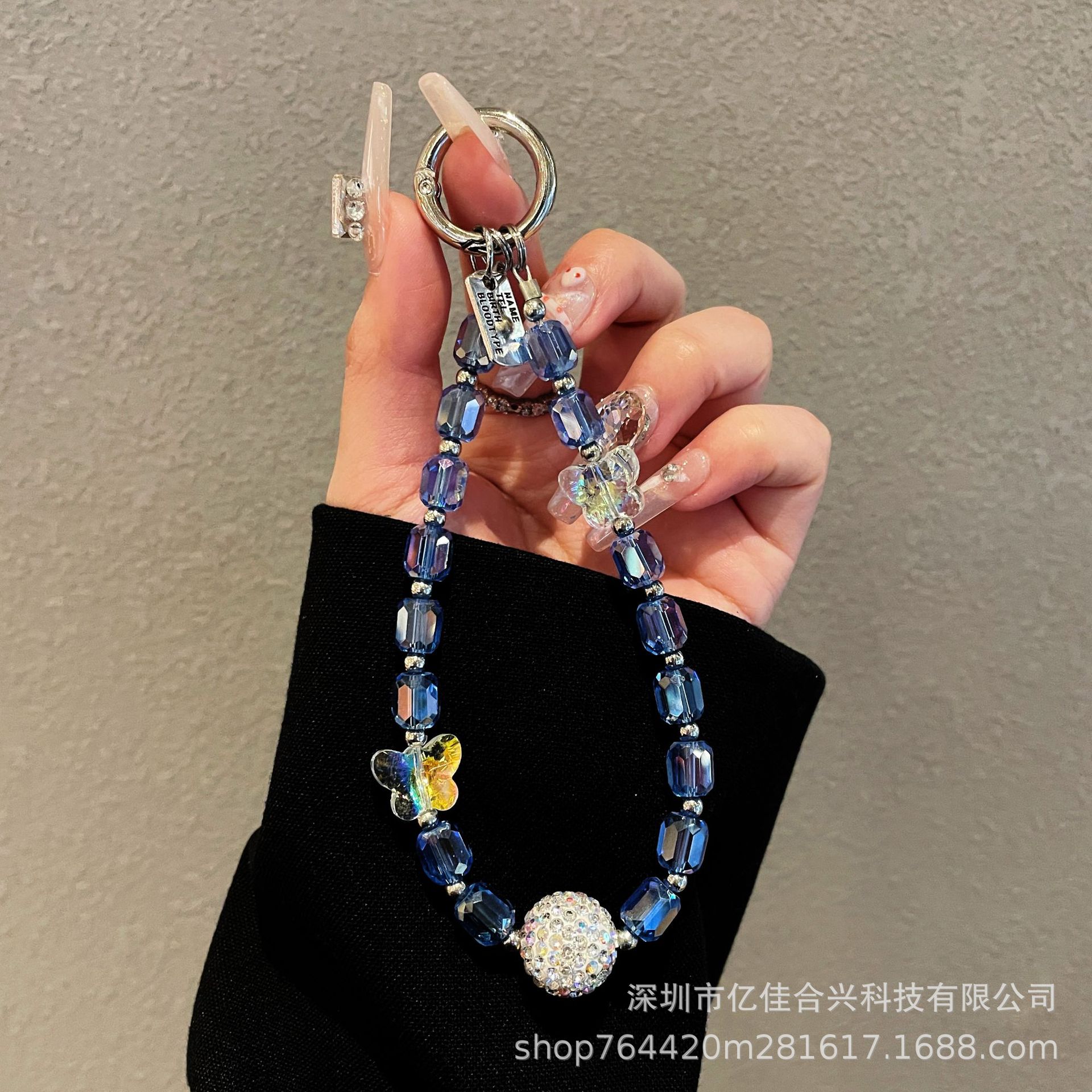 Japón y Corea del Sur estilo transfronterizo nuevo caso de teléfono móvil colgante cadena de cristal string arco de diamante cadena de teléfono móvil colgante de muñeca