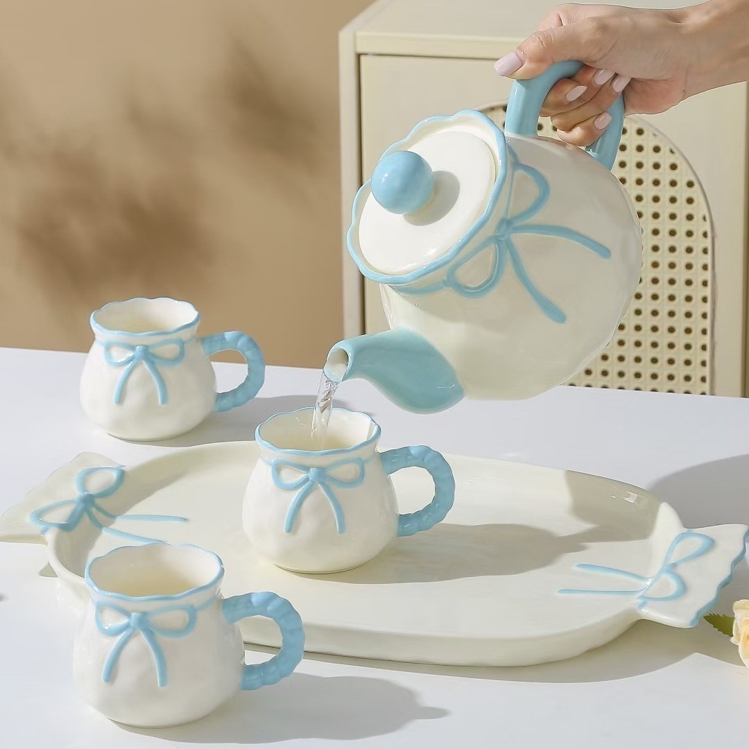 Personalidad creativa de alto valor facial arco hervidor de agua fría conjunto de tazas de cerámica acuario conjunto de nicho regalo de cumpleaños