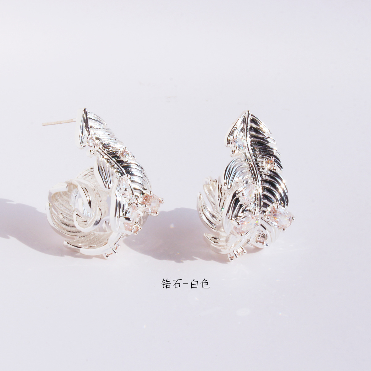 Small design three dimensional elegant earrings with zircon