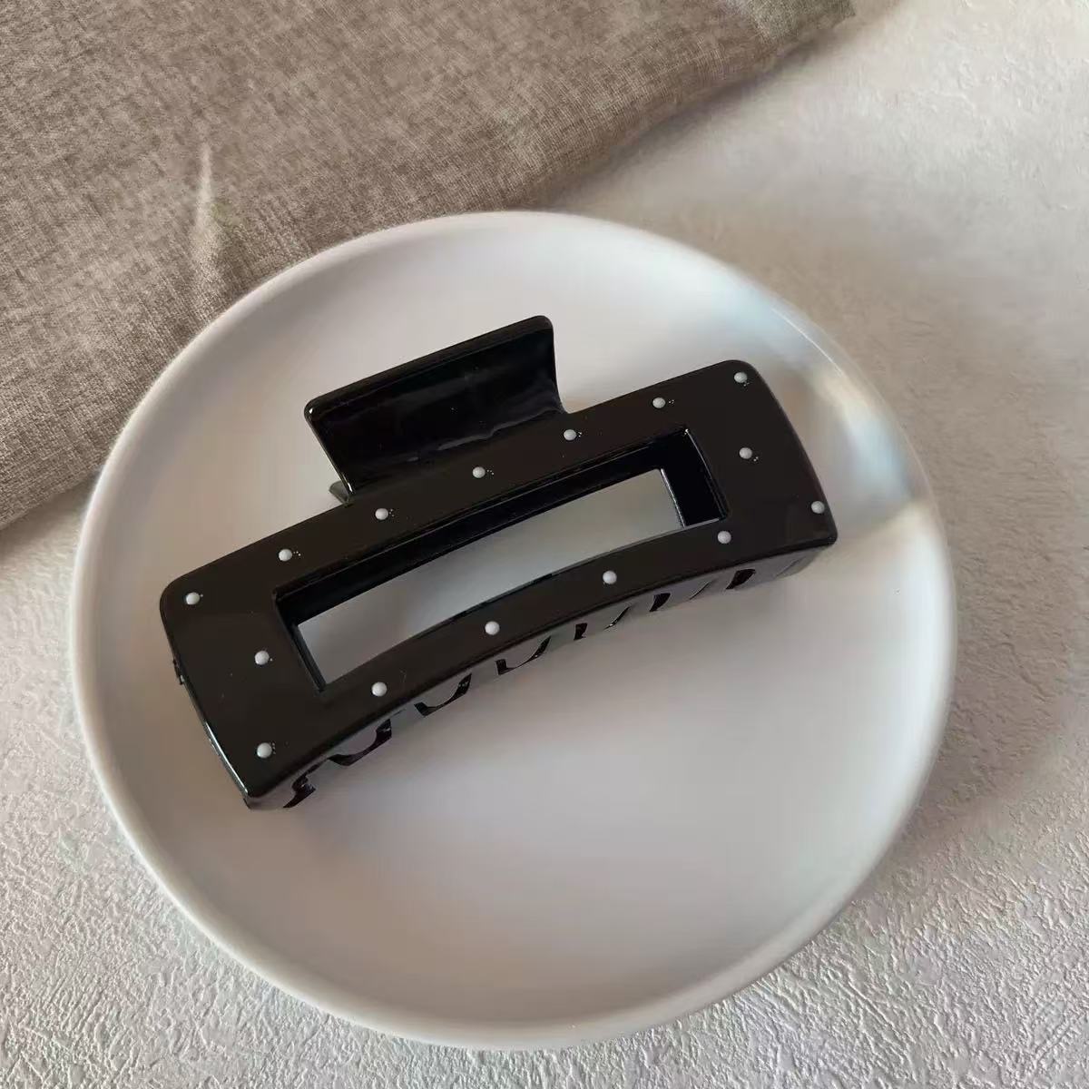 Black polka dot square