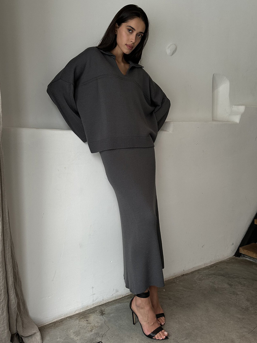 Conjunto de punto transfronterizo Europa y los Estados Unidos 2025 invierno nuevo estilo de moda minimalista viento suéter de punto de cuello V conjunto de falda de busto