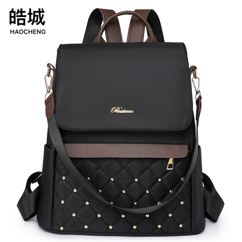 Venta al por mayor transfronteriza 2023 nueva mochila antirrobo de nailon para mujer coreana moda contraste color rombo mochila de doble uso marea