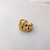 Golden one size adjustable ring, woven fence, 18 carat, European style, on index finger