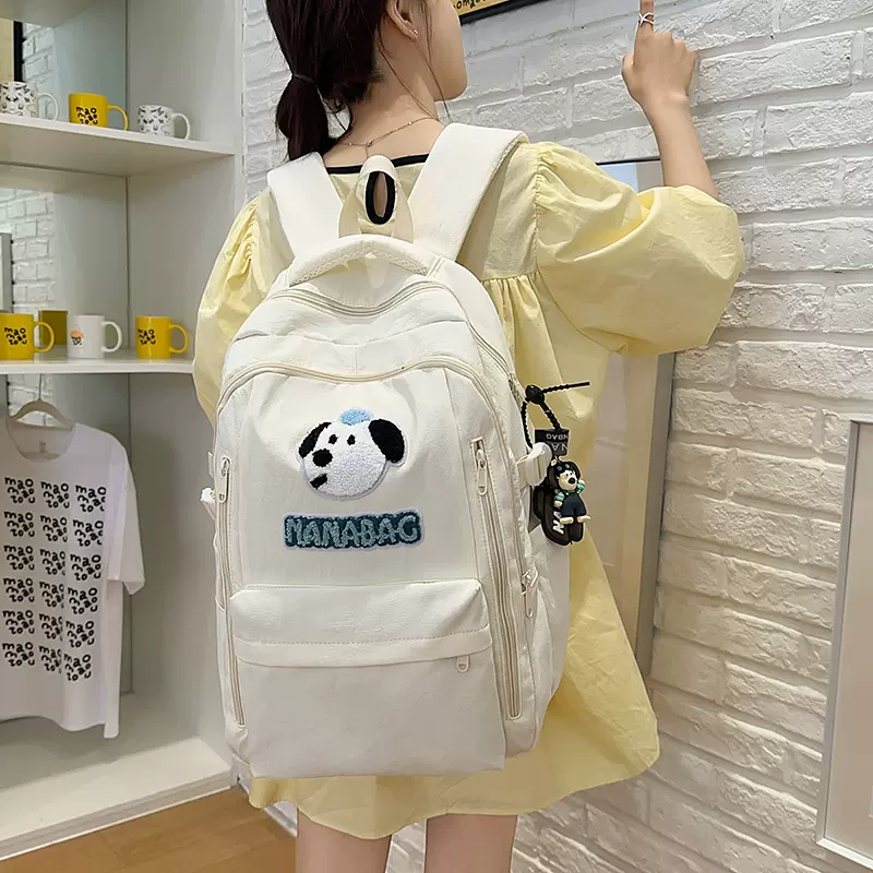 书包初中生书包高颜值可爱小狗双肩包休闲轻便减负旅行高中生背包
