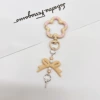 Grapefruit color/meat powder (flower spring buckle + bow combination keychain)