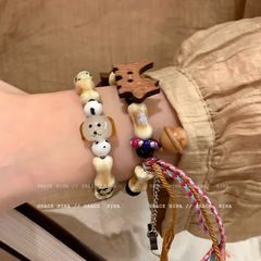 新しい中国式の子供の趣味のかわいい木の子犬の骨は鈴の手を編みます。