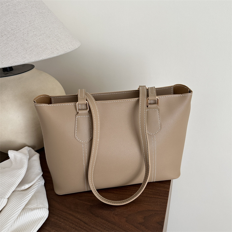 Bolso de viaje de alta gama retro 2025 primavera nuevo estilo salvaje ins color sólido bolso de hombro de trabajo bolso Tote