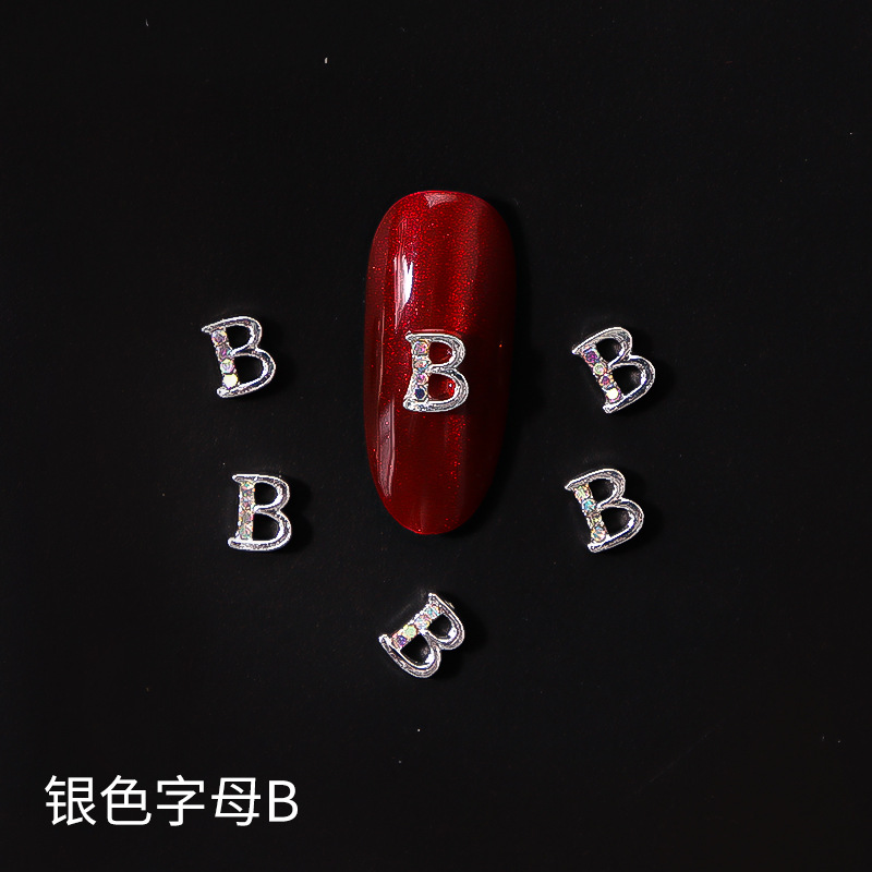 Nueva LZ manicura 26 letras aleación joyería estilo japonés Internet celebridad plata letras manicura joyería clavo Taladro