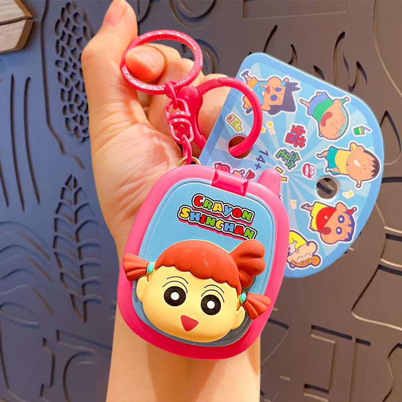 Crayons, mobile phone, game console, keychain