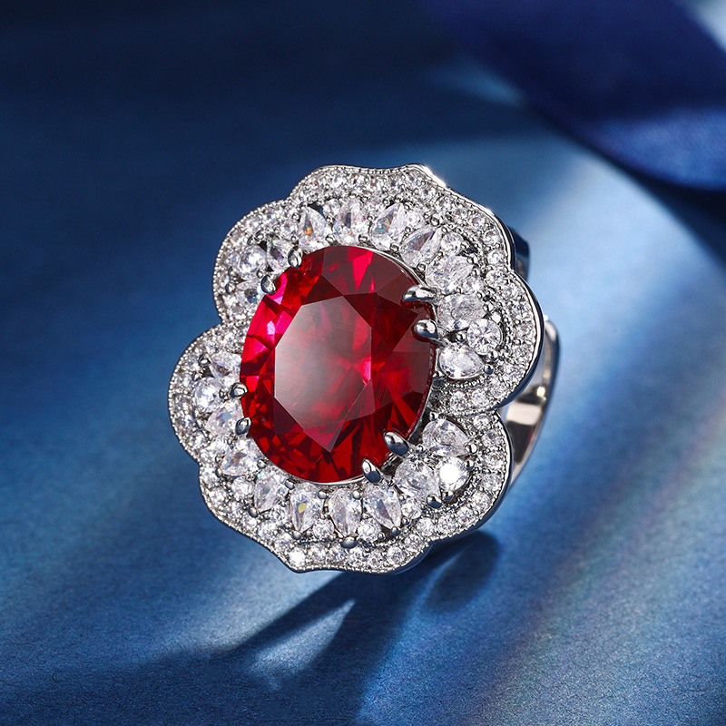 Otoño e invierno Nueva Zhuang Sheng joyería de cobre inferior chapado en oro simulación rojo corindón zafiro azul cristal puntiagudo traje avanzado femenino 12*14