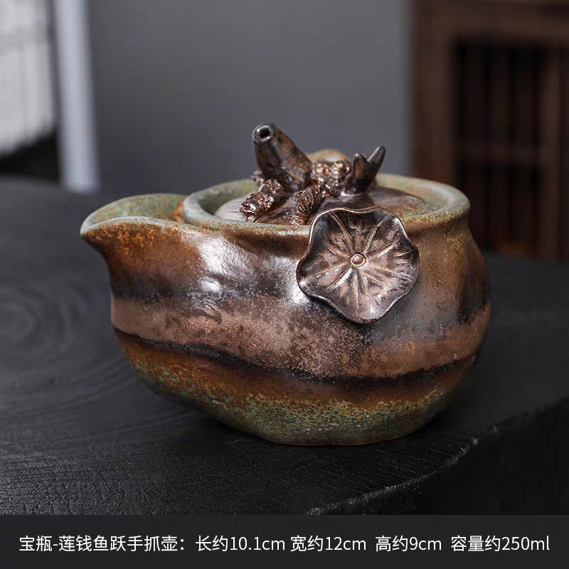 Transfronterizos de madera de bronce esmalte tetera de cerámica tetera botella de oro mano agarrar tetera retrógrada casera hecha a mano kung fu té