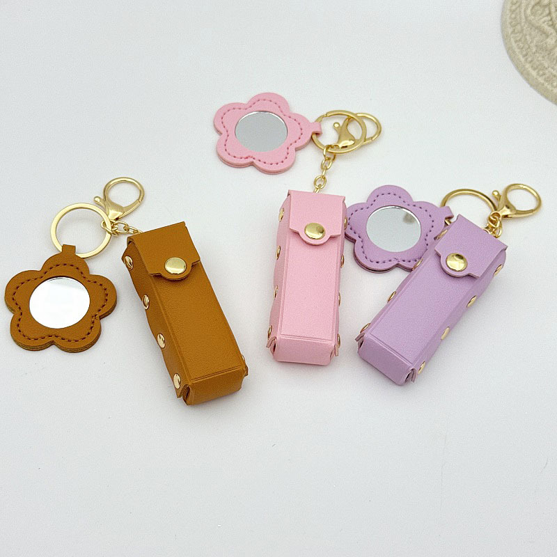 Flor espejo llavero cuero transfronterizo regalo colgante joyería creativo mini lápiz labial almacenamiento llavero colgante