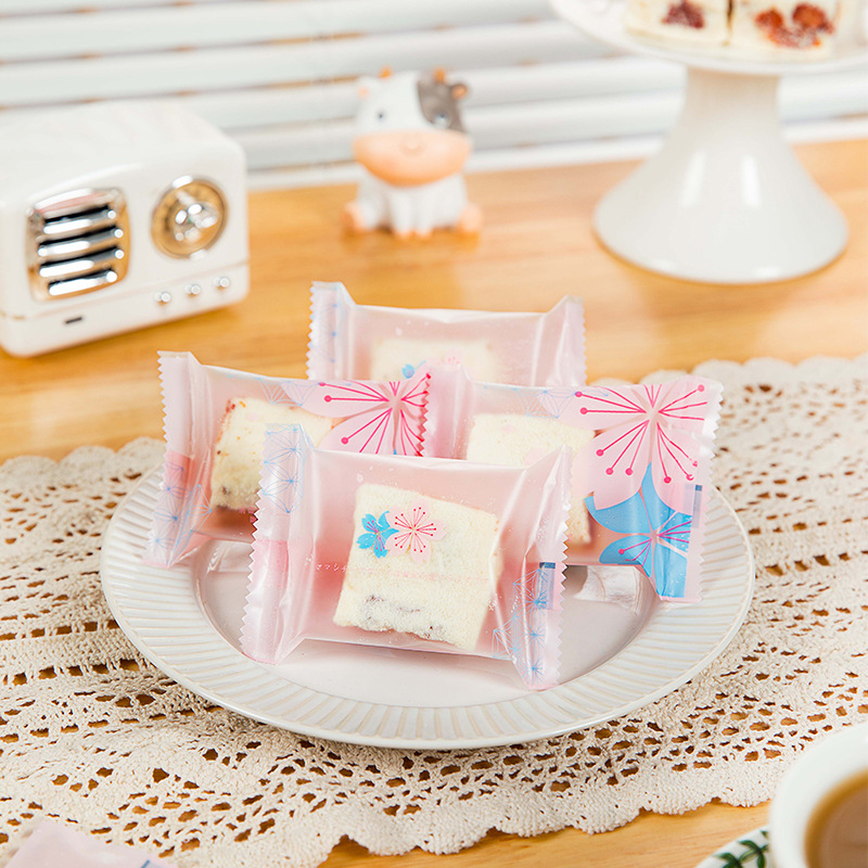 Copo de nieve de poliéster máquina crujiente sello autosellante embalaje turrón galleta embalaje transparente azufaifo leche bolsa de embalaje 100 piezas